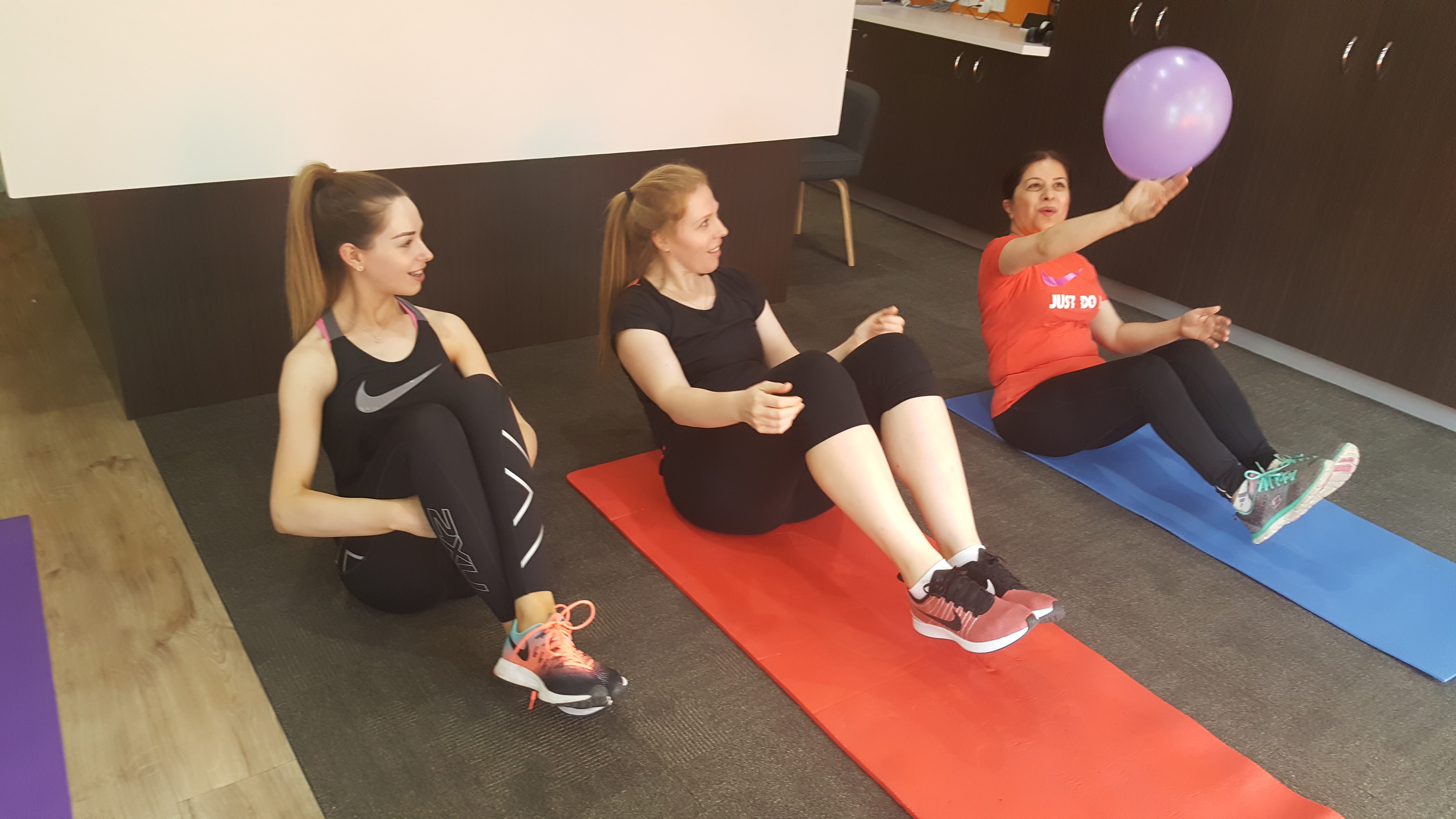 a group of ladies working out together