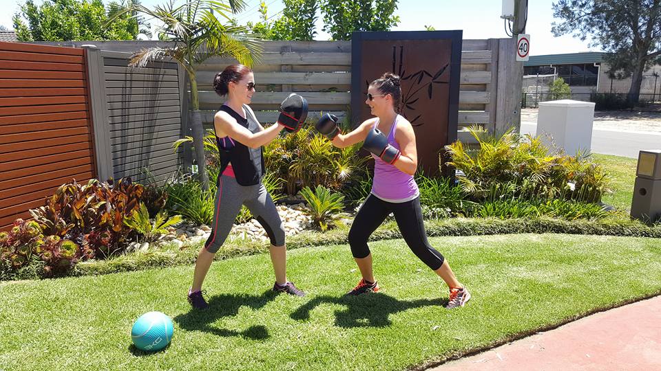 2 girls doing some boxing cardio